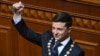 UKRAINE -- Ukrainian President-elect Volodymyr Zelenskiy holds the presidential stamp during his inauguration ceremony at the parliament in Kyiv, May 20, 2019